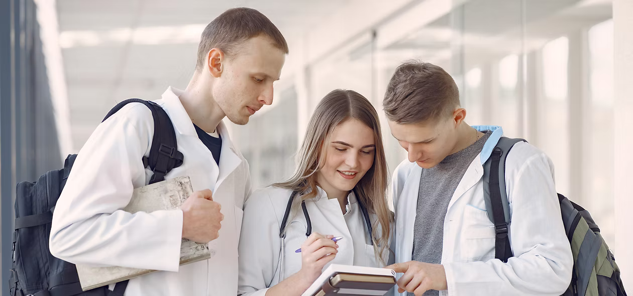 Medical students talking in a hallway